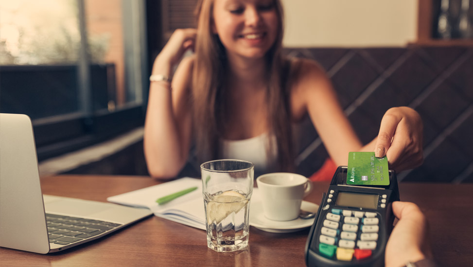 Lady paying with Regions Bank credit card